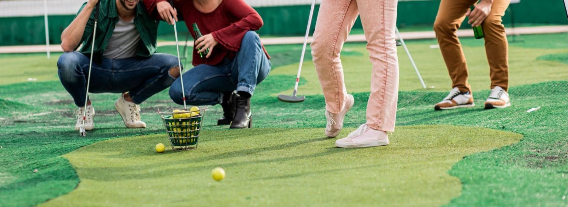 group of friends playing mini golf