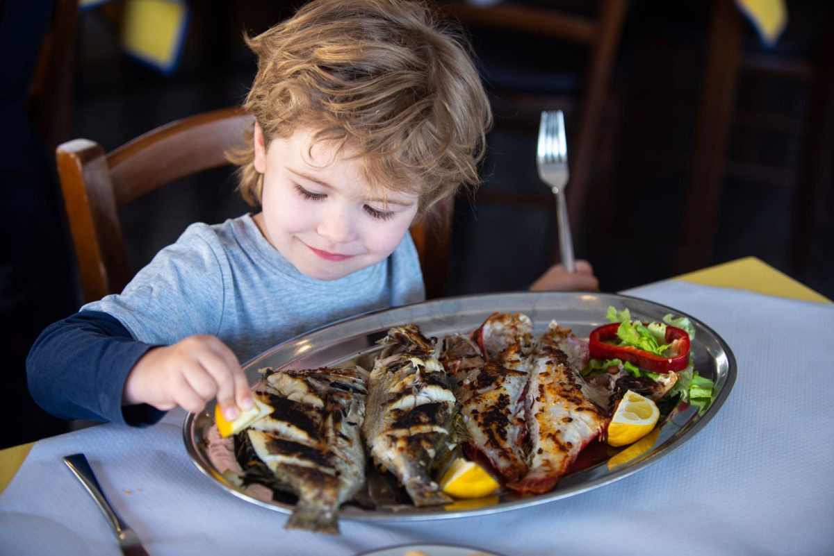 Child enjoying freash seafood