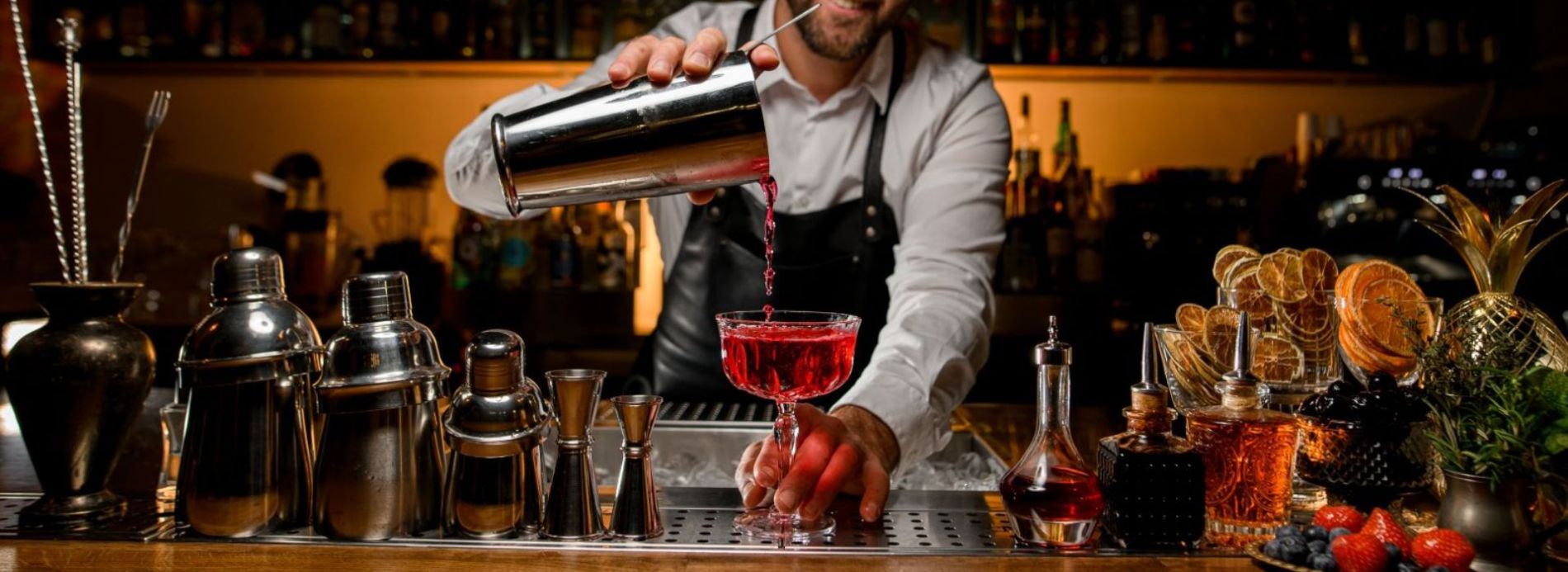 Bar tender pouring a drink