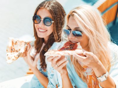 Women eating pizza