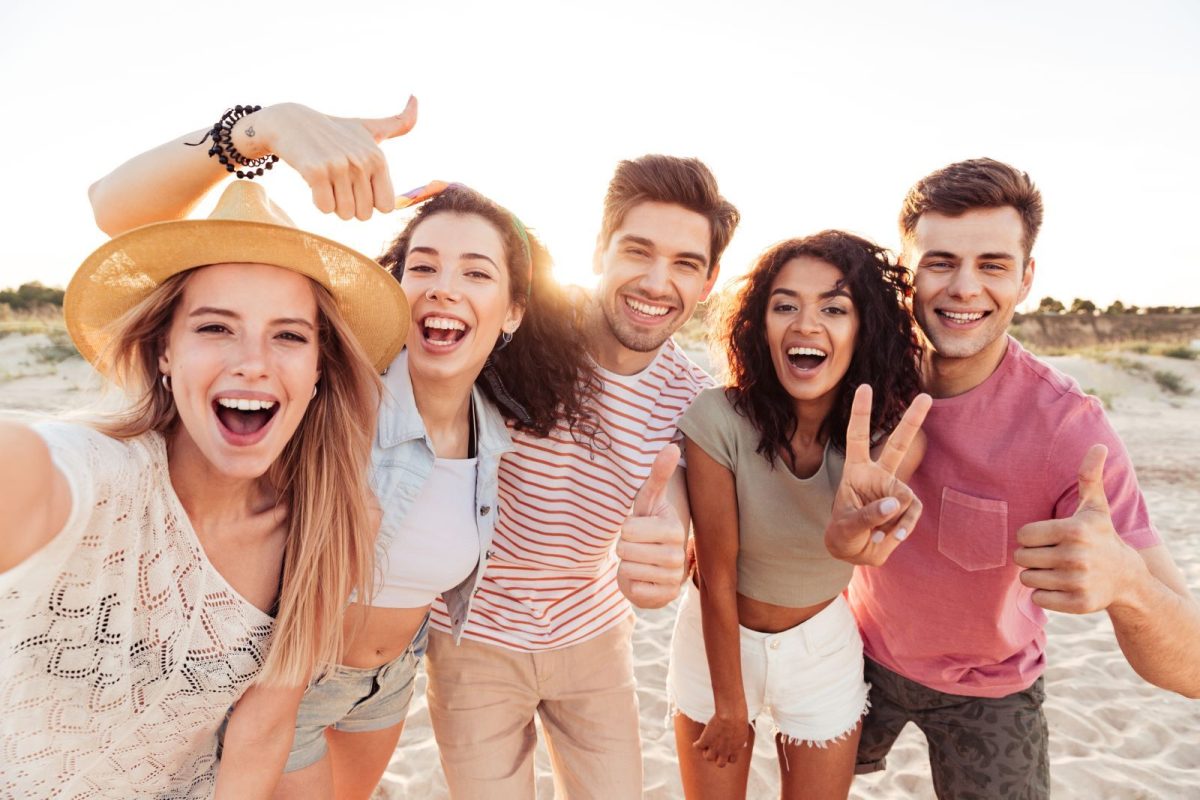 a group of friends smiles for a photo